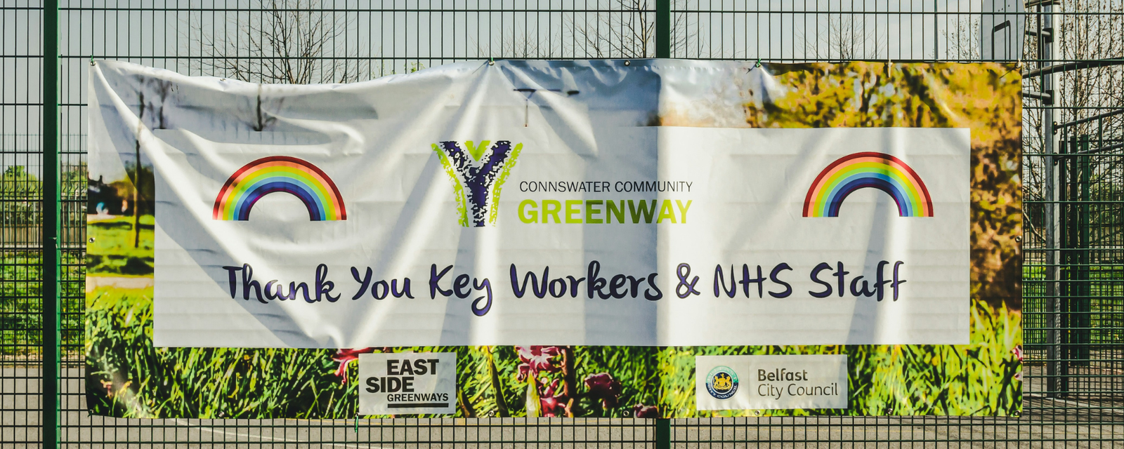 Multiple storefront sign types including banners, window graphics, and sidewalk signs